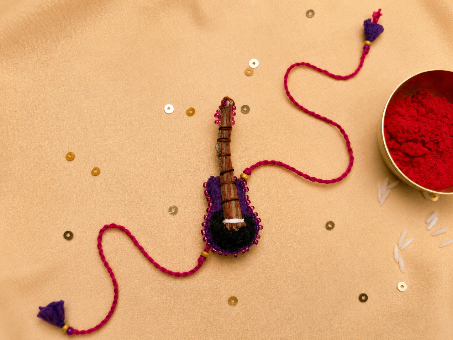 Hand embroidered Guitar Rakhi-Purple