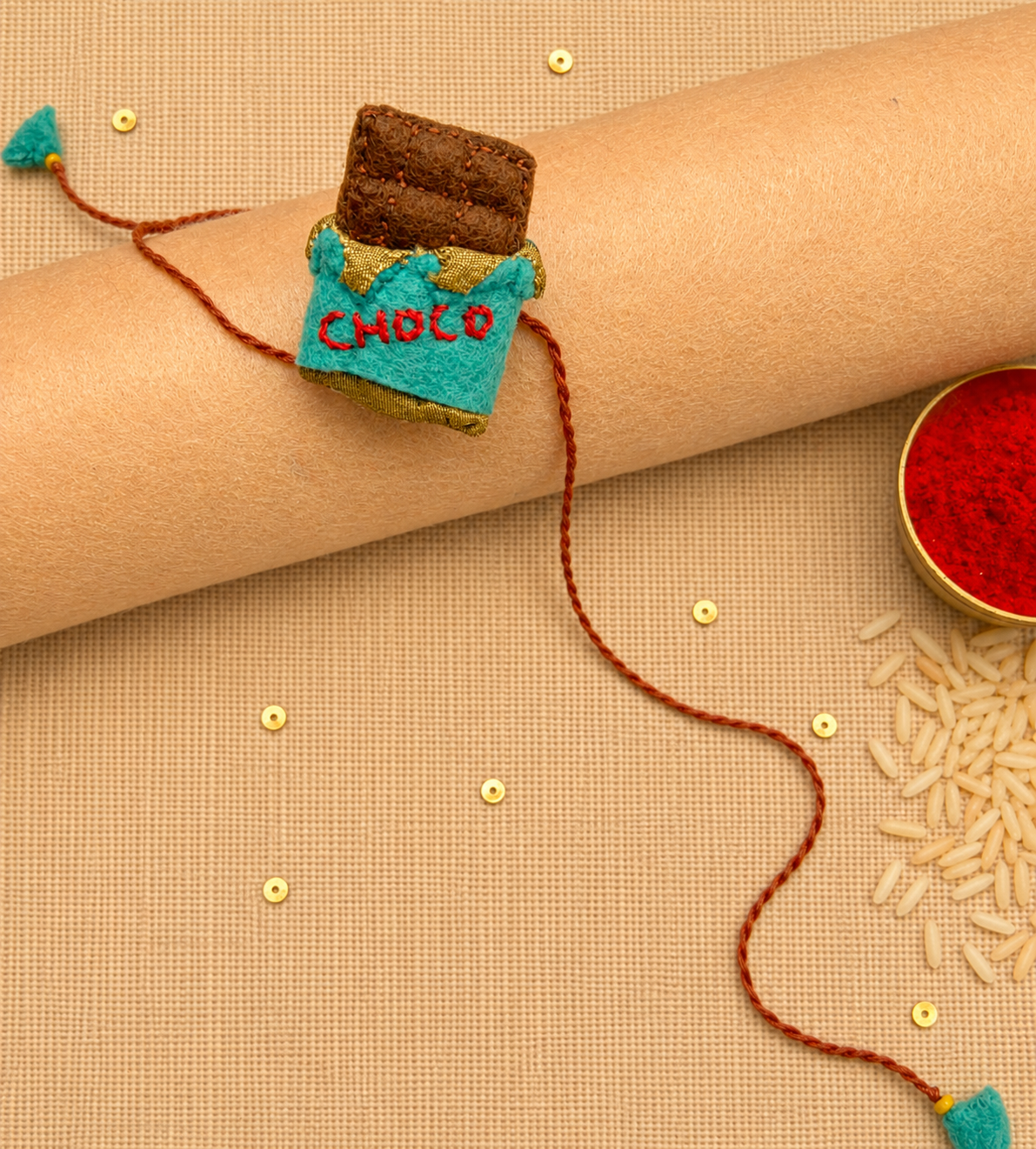 Hand embroidered Chocolate Rakhi- Sea Green