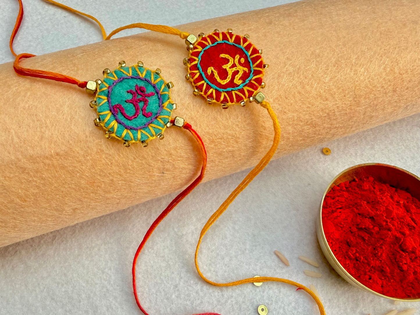 Hand embroidered Aum Mandala Rakhi (Set of 2) Sea Green-Red