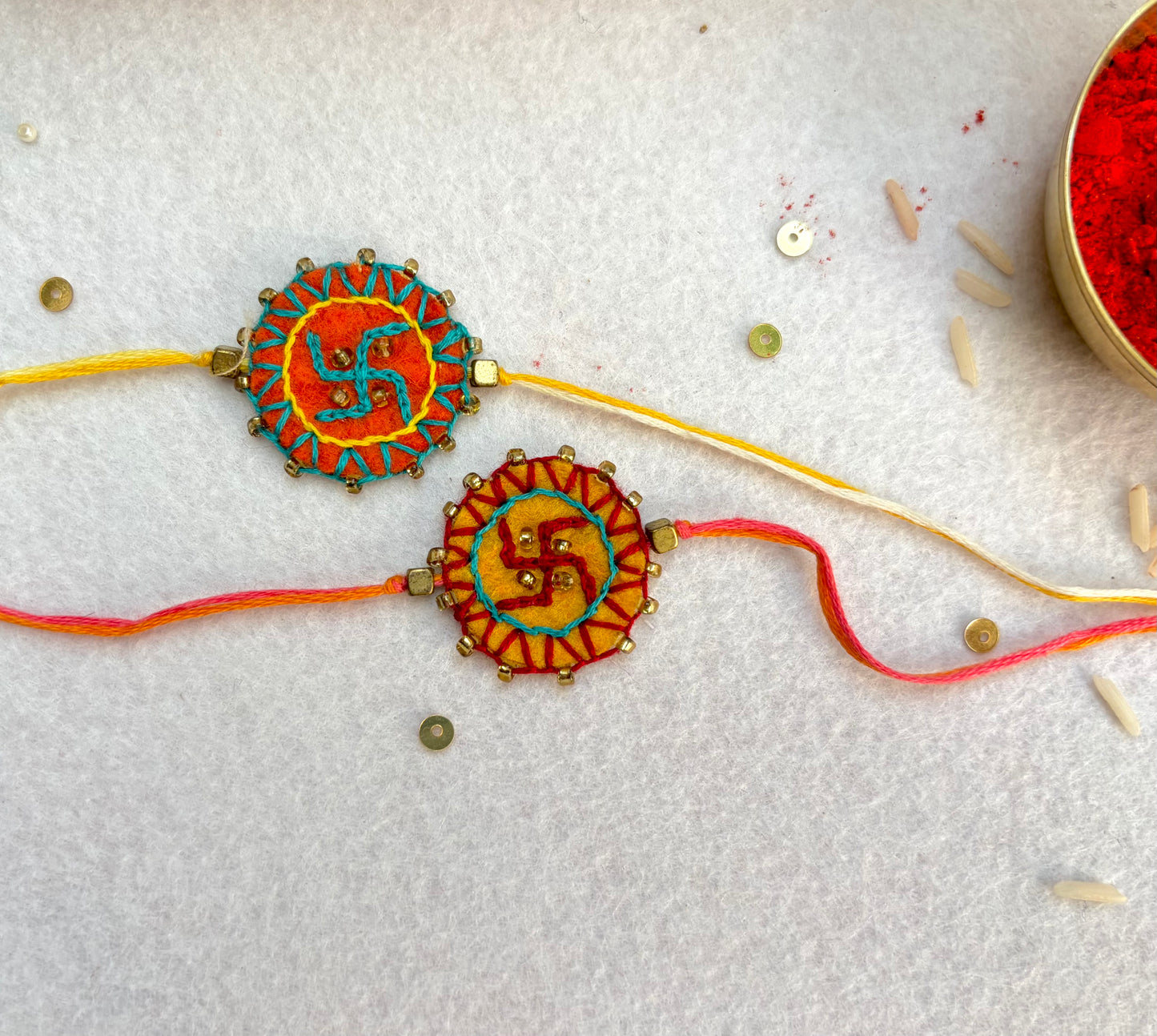 Hand embroidered Swastika Mandala Rakhi (Set of 2) Yellow-Orange