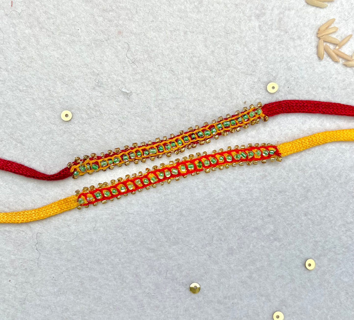 Hand embroidered Beaded Chain Rakhi (Set of 2)- Yellow-Red