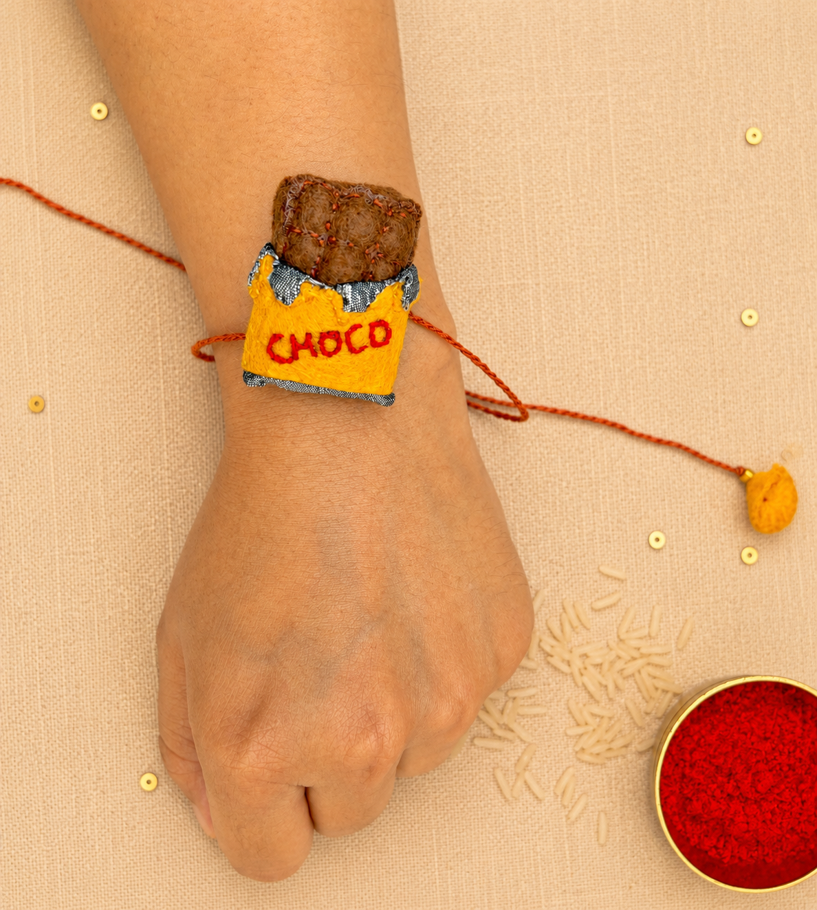 Hand embroidered Chocolate Rakhi- Yellow