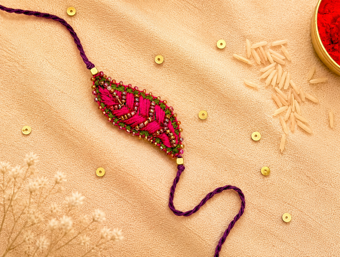 Hand embroidered Leaf Ornamental Rakhi (Pink)
