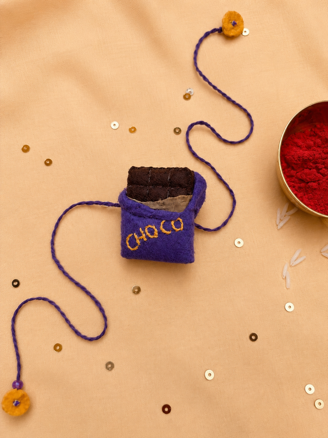 Hand embroidered Chocolate Rakhi- Purple
