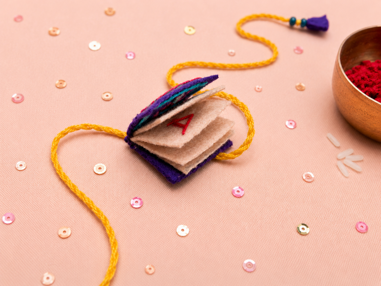 Hand embroidered Book Rakhi-Purple