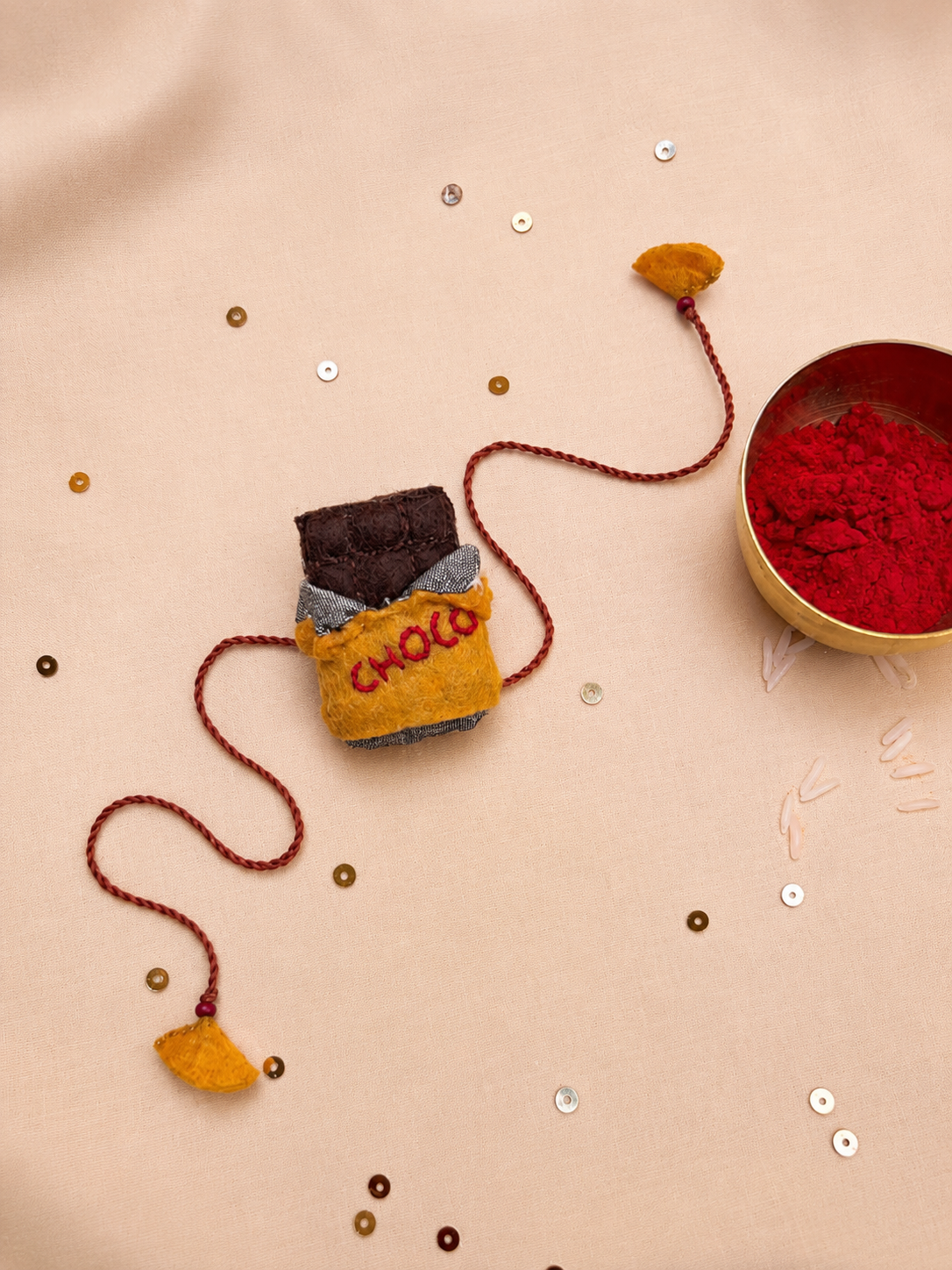 Hand embroidered Chocolate Rakhi- Yellow