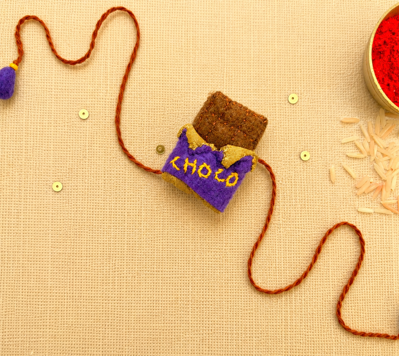 Hand embroidered Chocolate Rakhi- Purple