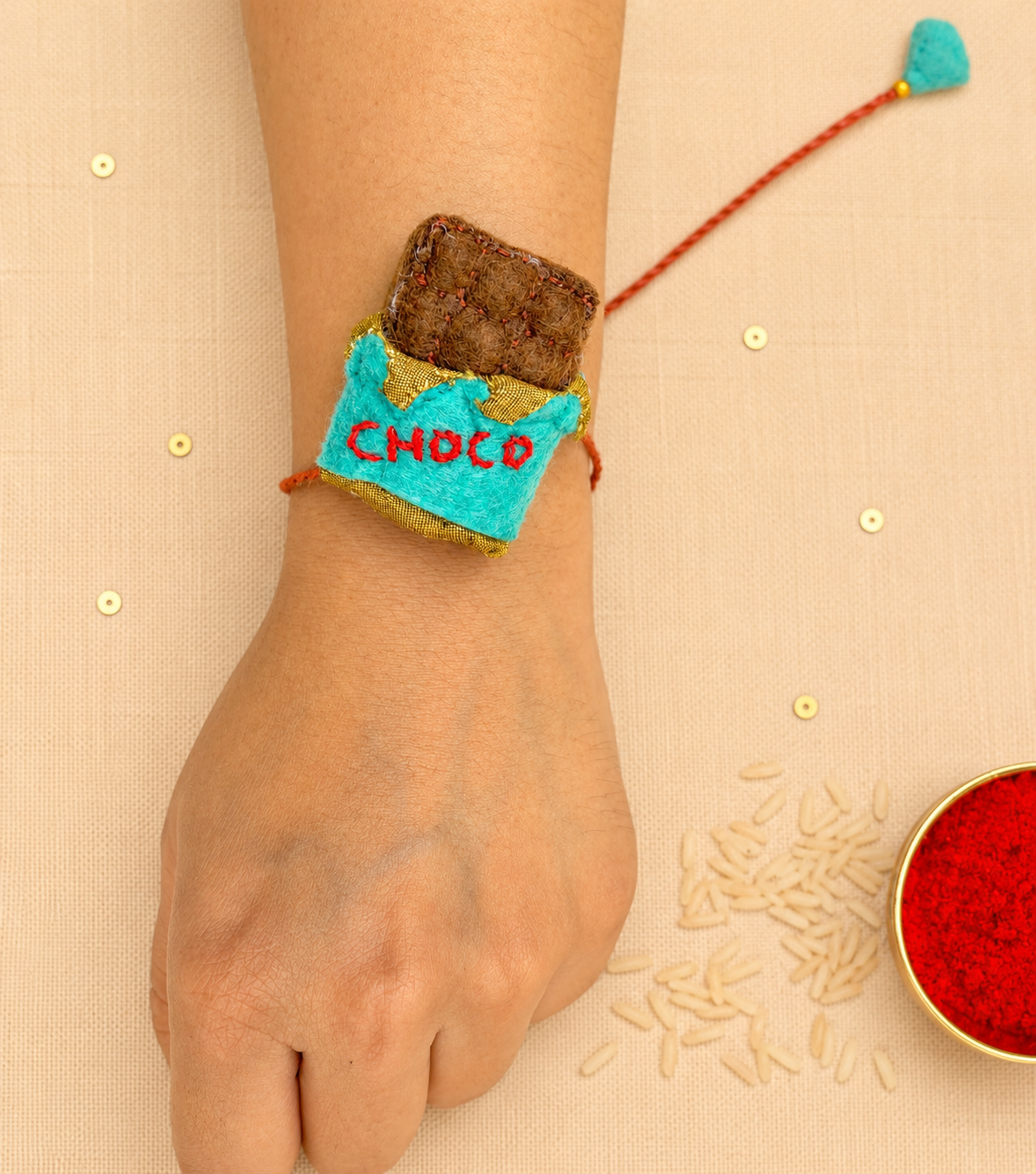 Hand embroidered Chocolate Rakhi- Sea Green