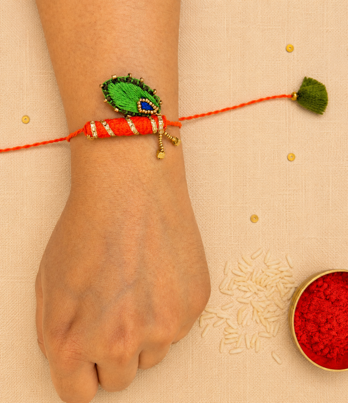 Hand embroidered Bansuri Rakhi-Orange