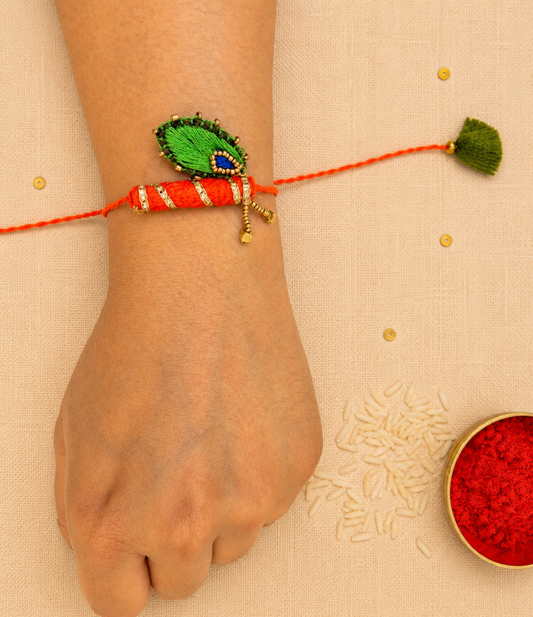 Hand embroidered Bansuri Rakhi-Orange