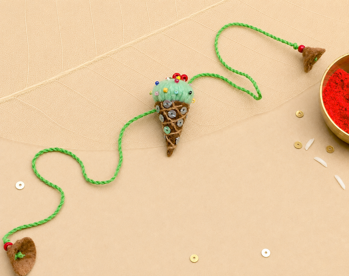 Hand embroidered Ice-Cream Rakhi-Pista Green