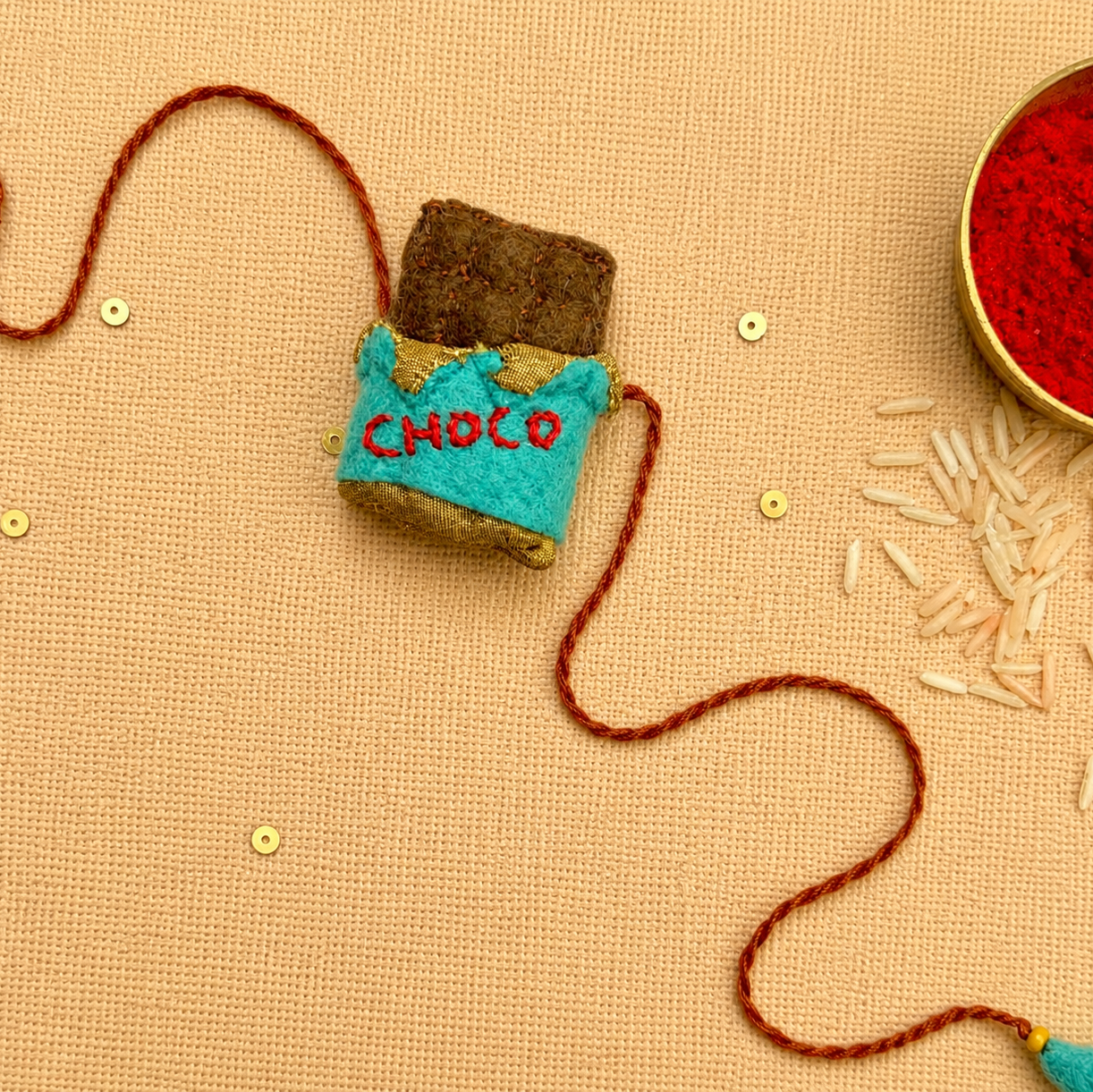 Hand embroidered Chocolate Rakhi- Sea Green