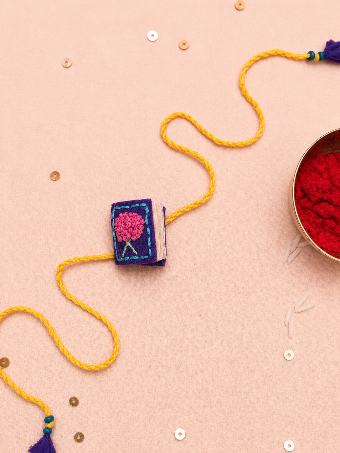 Hand embroidered Book Rakhi-Purple
