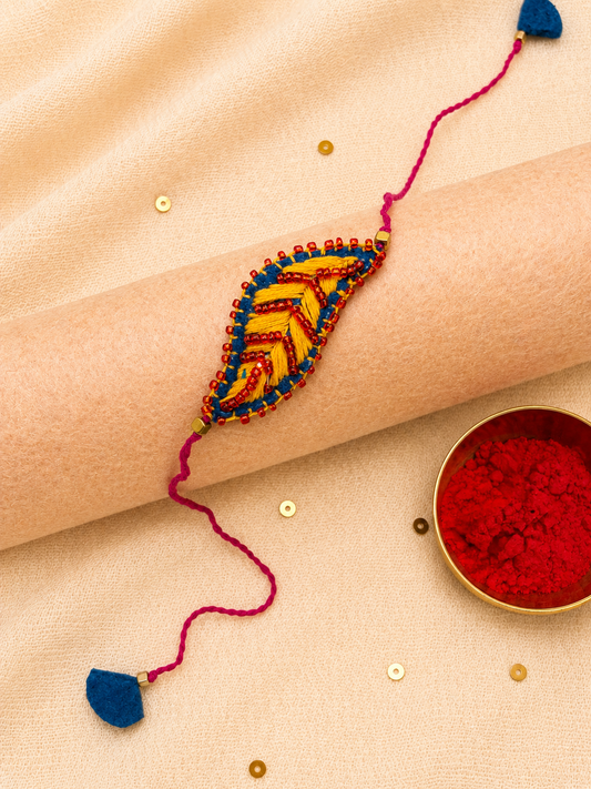 Hand embroidered Leaf Ornamental Rakhi (Yellow)