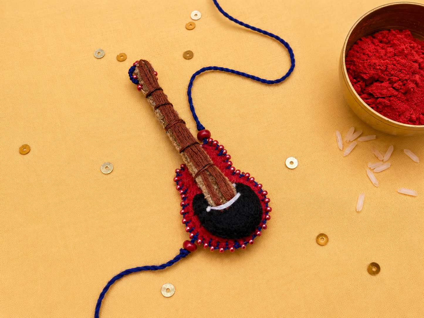 Hand embroidered Guitar Rakhi-Red