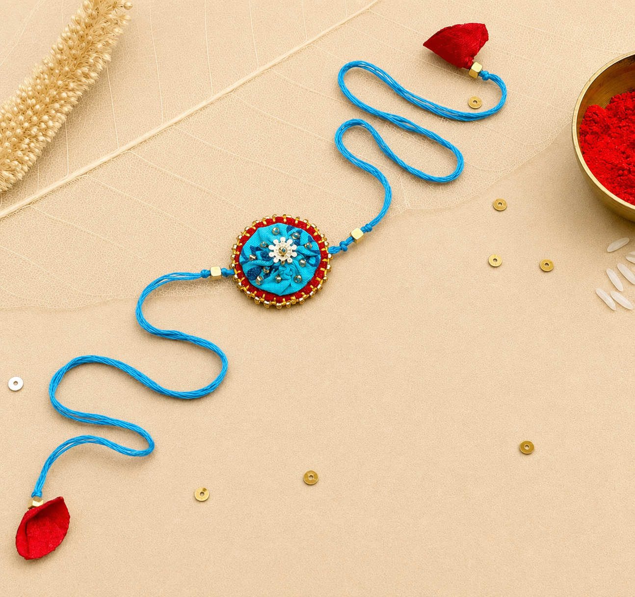 Hand embroidered Ragini Rakhi-Turquoise Print