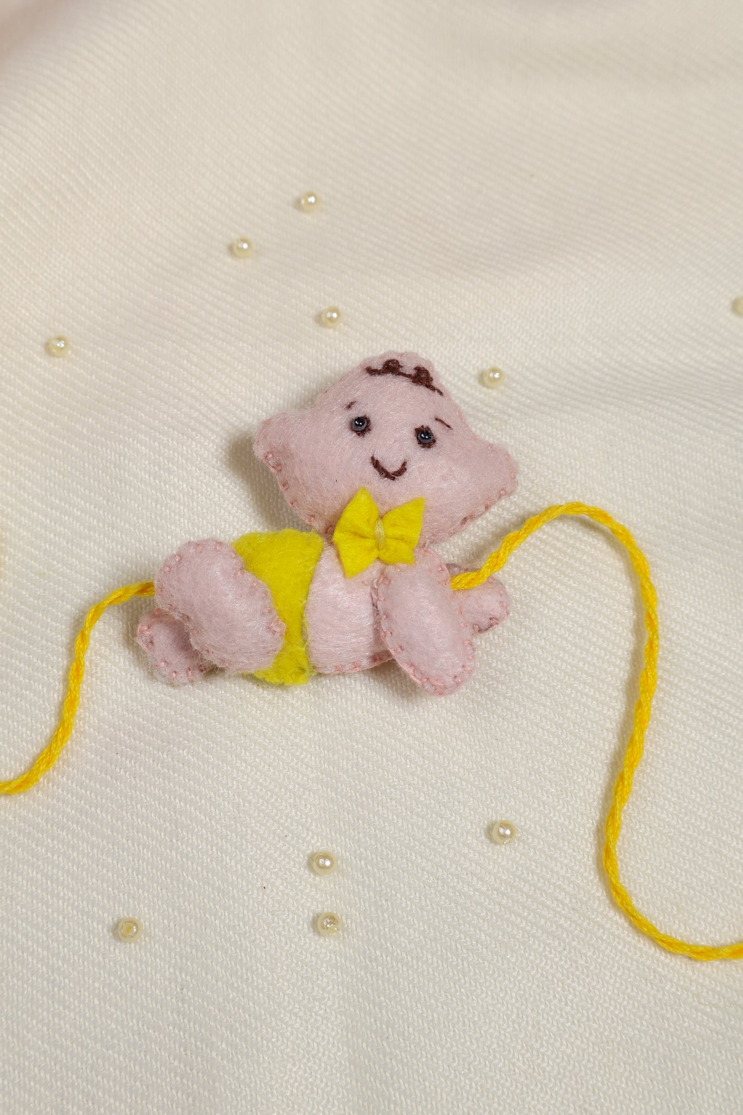 Hand embroidered Crawling Baby Rakhi-Yellow