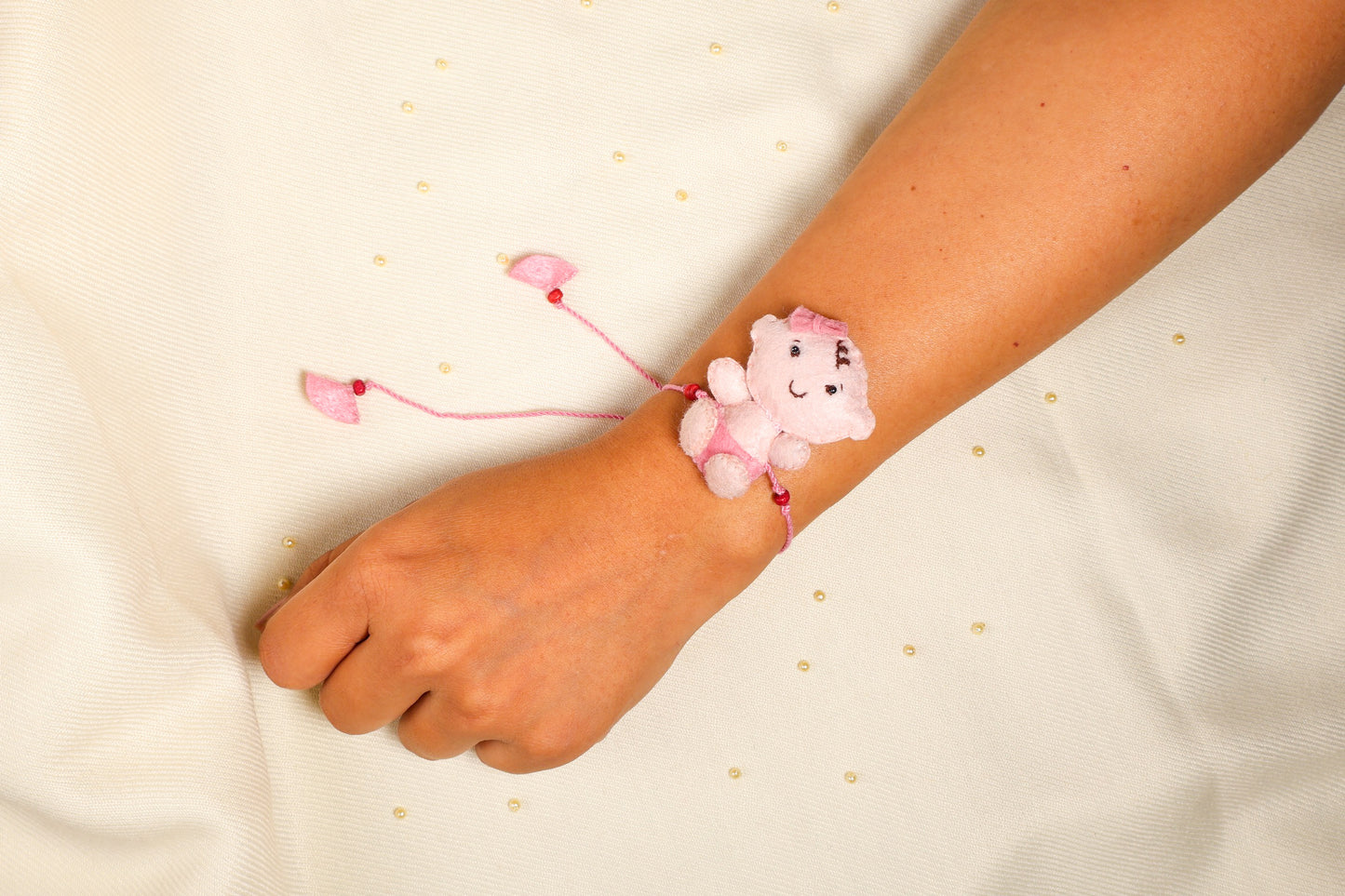 Hand embroidered Adorable Baby Rakhi-Pink