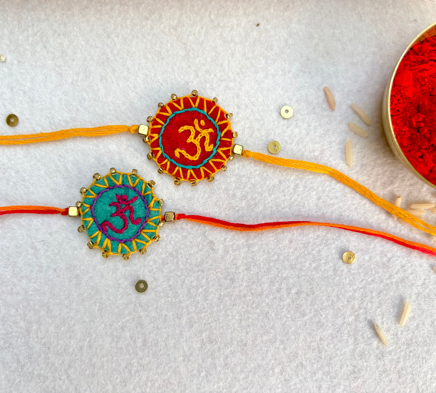 Hand embroidered Aum Mandala Rakhi (Set of 2) Sea Green-Red