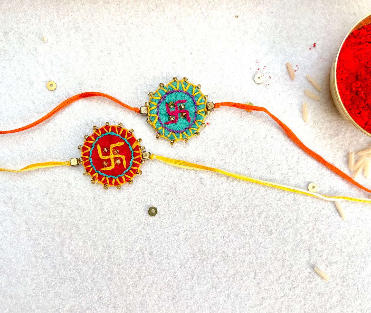 Hand embroidered Swastika Mandala Rakhi (Set of 2) Red-Sea Green