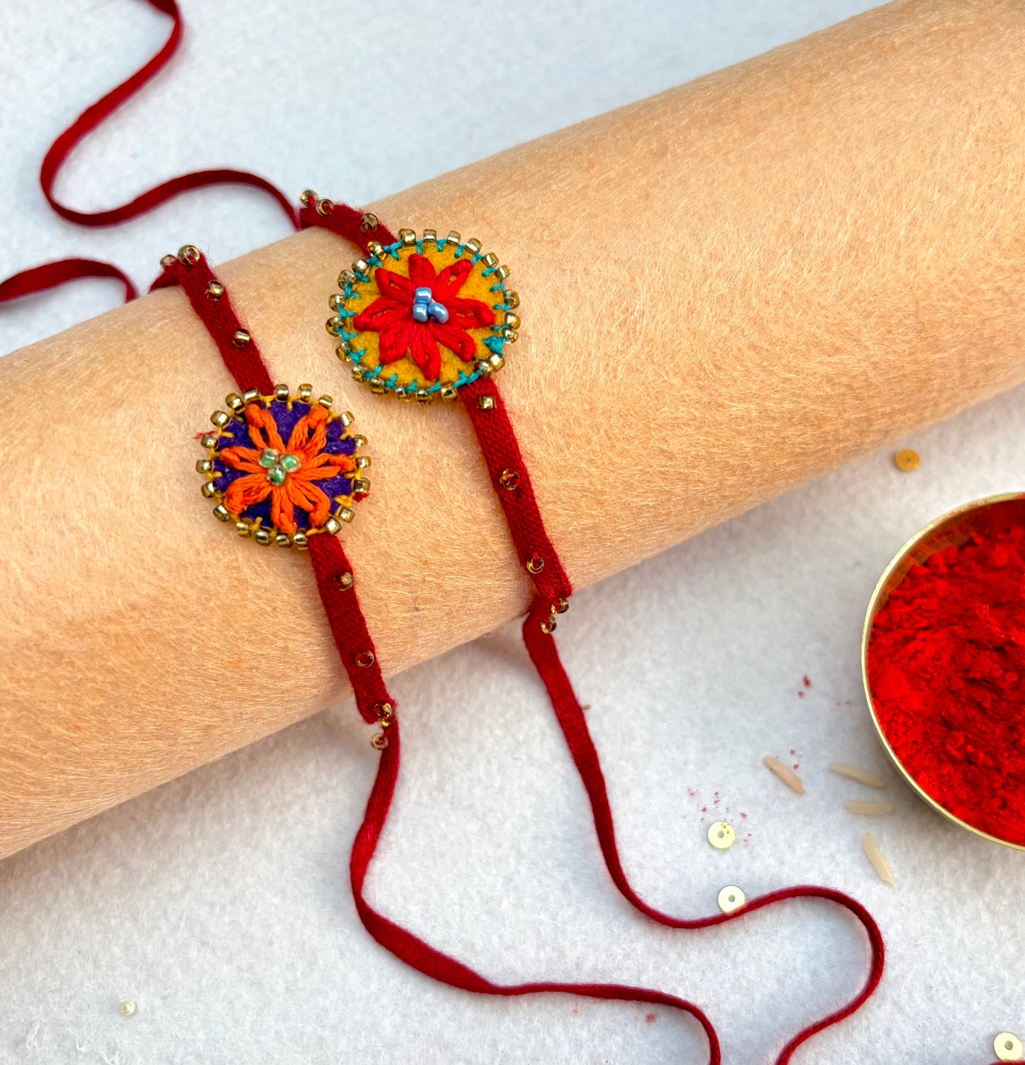 Hand embroidered Flower daisy Rakhi (Set of 2) Red-Orange