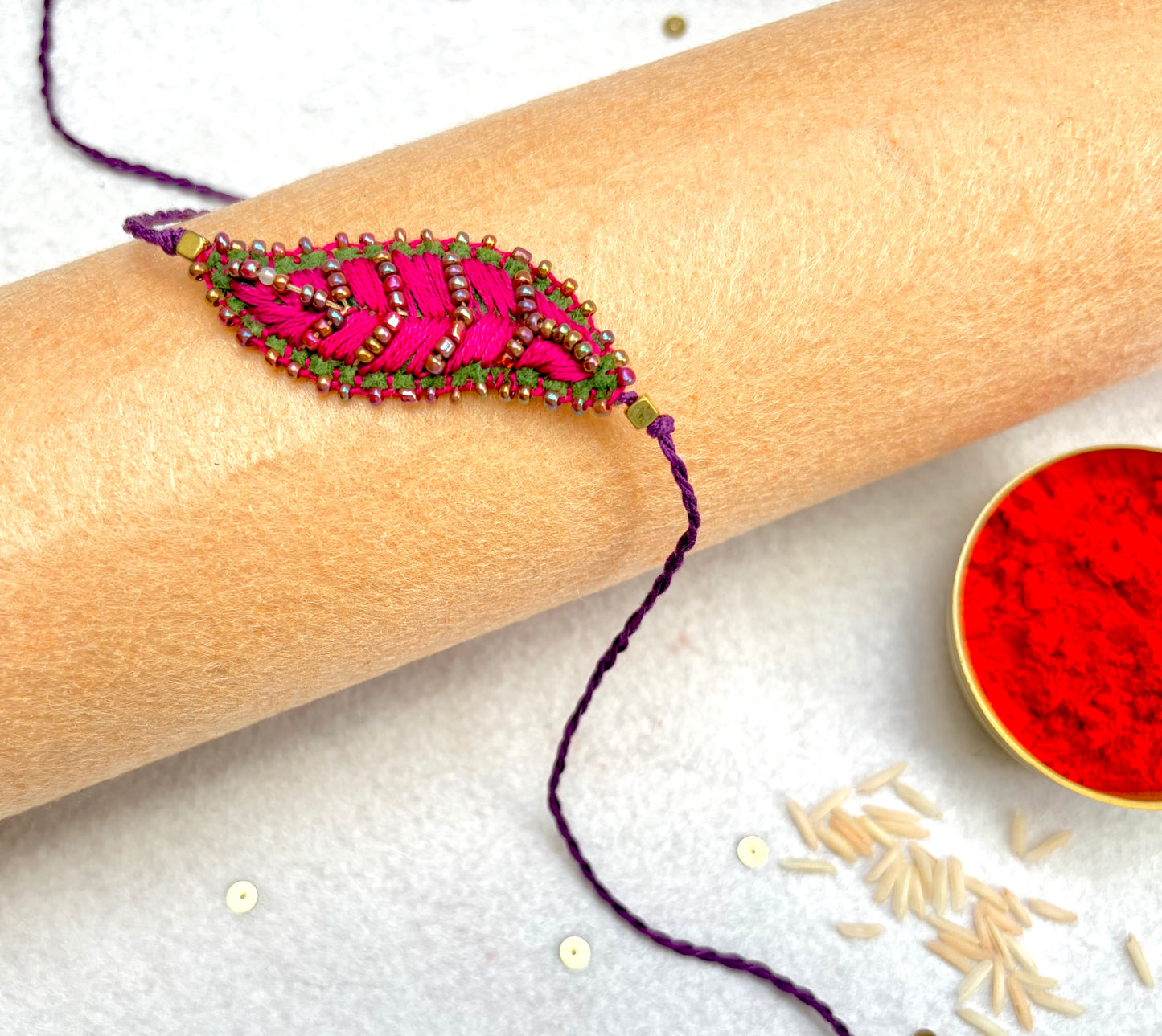 Hand embroidered Leaf Ornamental Rakhi (Pink)