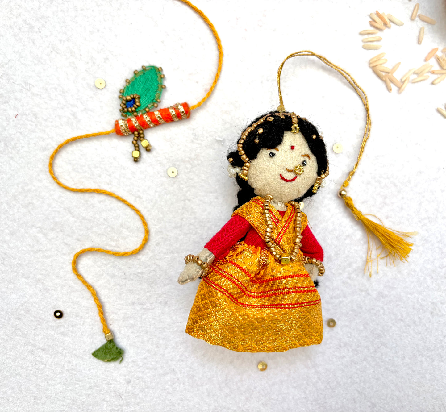 Radha Bansuri Rakhi Lumba Set (Set of 2)- Yellow-Orange