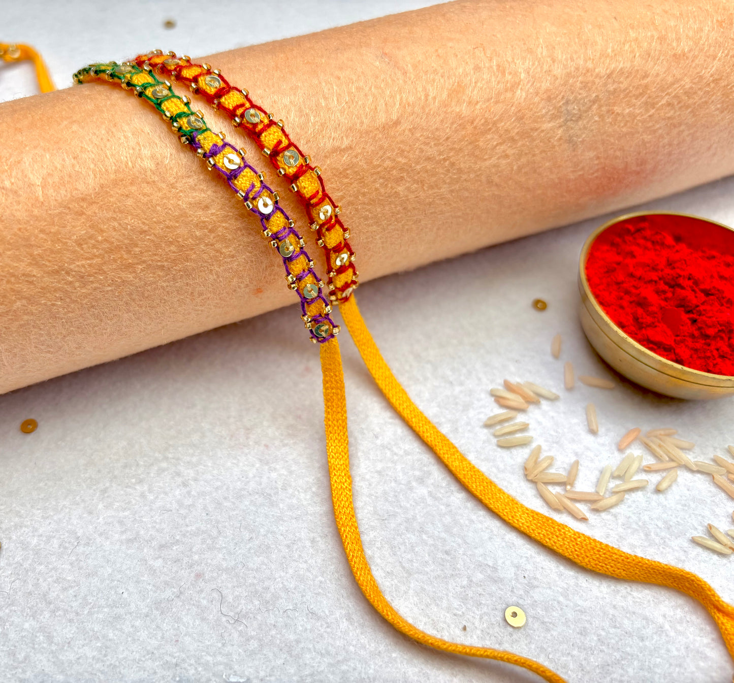 Hand embroidered Blanket Sequin Rakhi (Set of 2)- Red-Purple Green