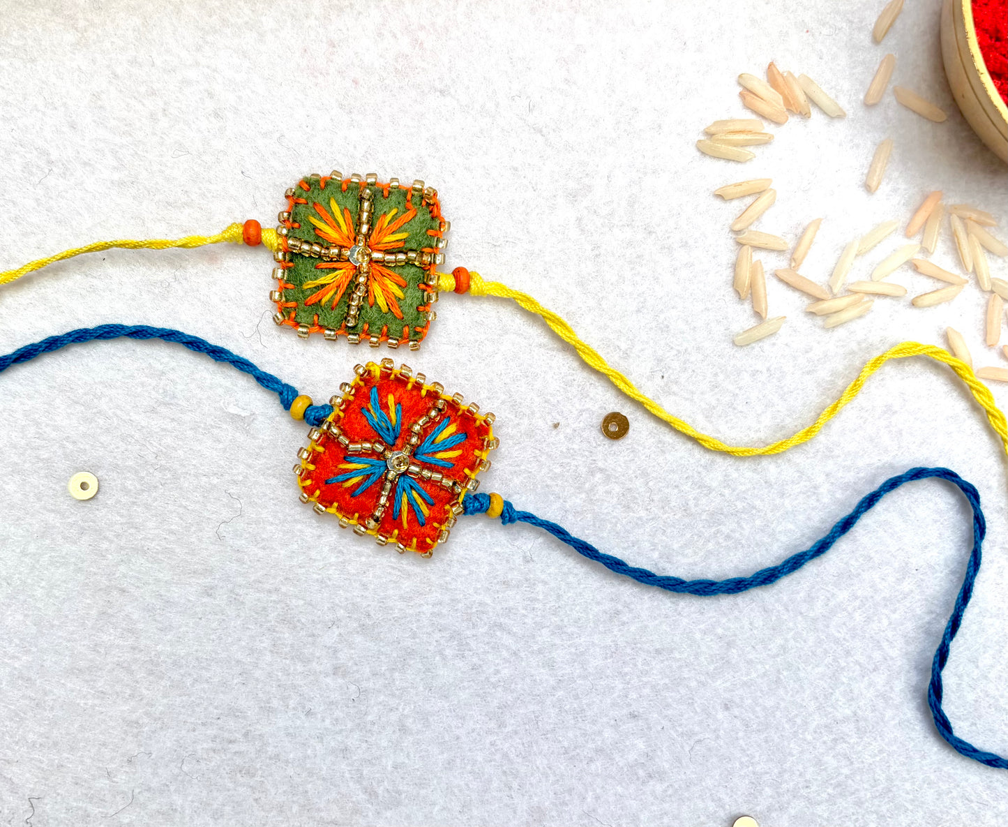 Hand embroidered Chowk Rakhi (Set of 2)- Green-Orange
