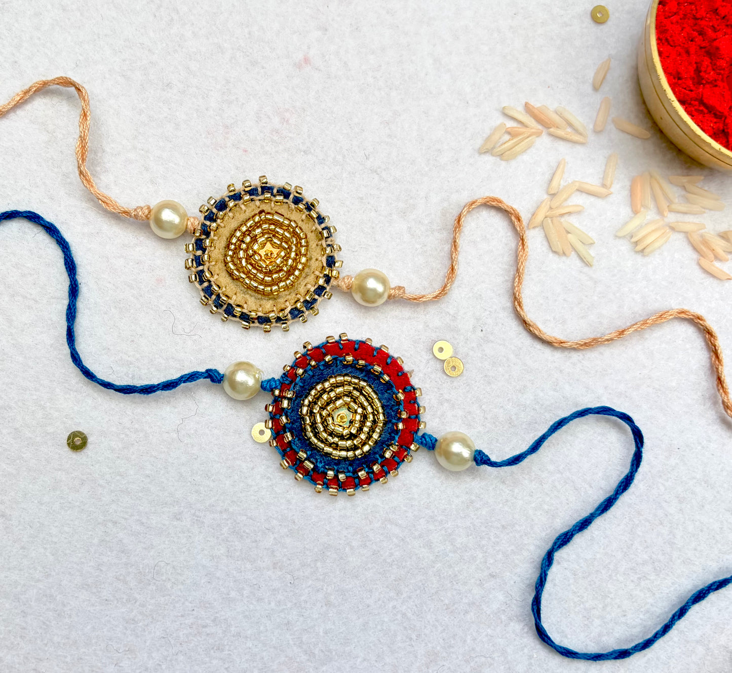 Hand embroidered Sitara Mandal Rakhi (Set of 2)- Maroon Blue-Beige