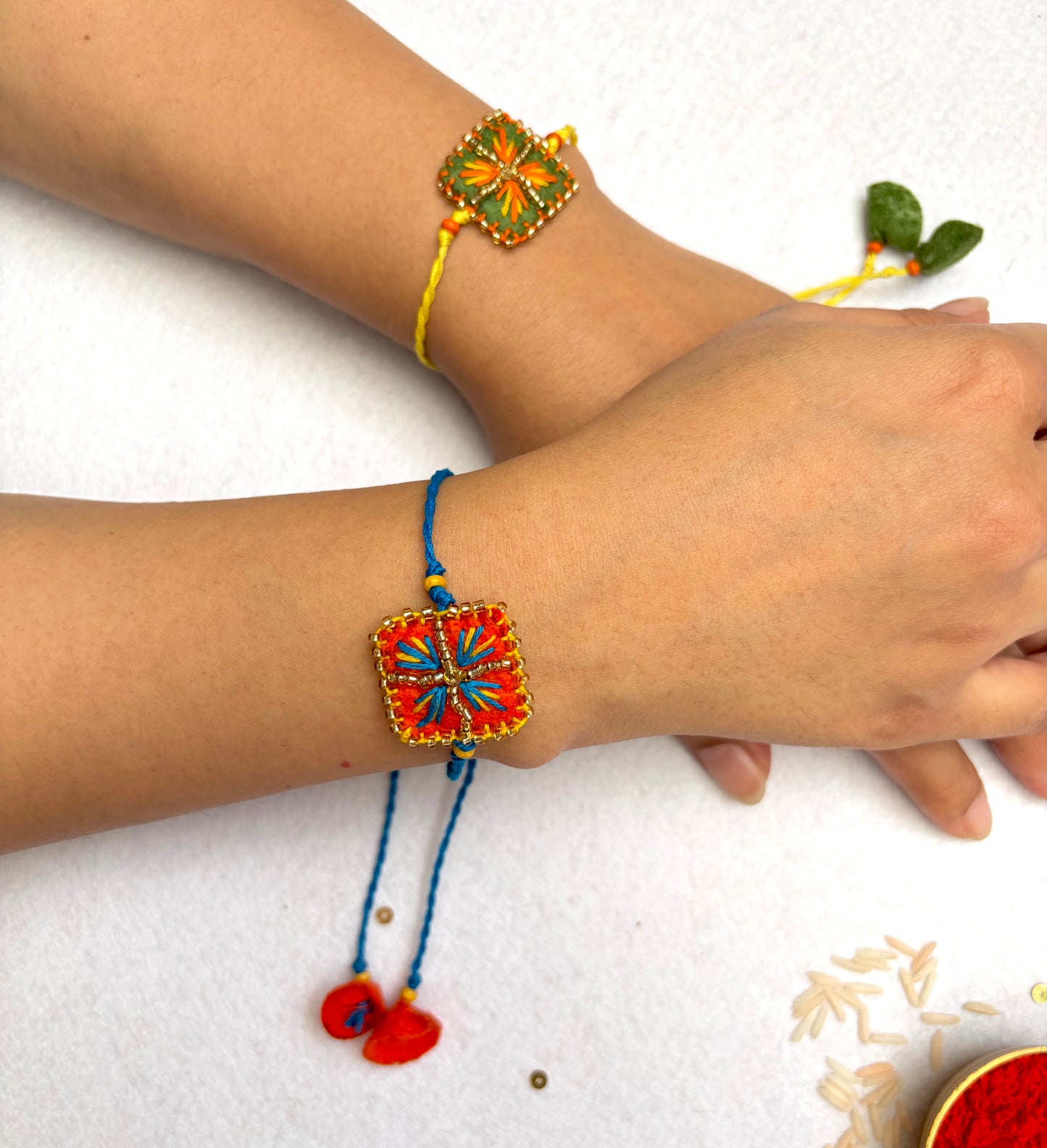 Hand embroidered Chowk Rakhi (Set of 2)- Green-Orange