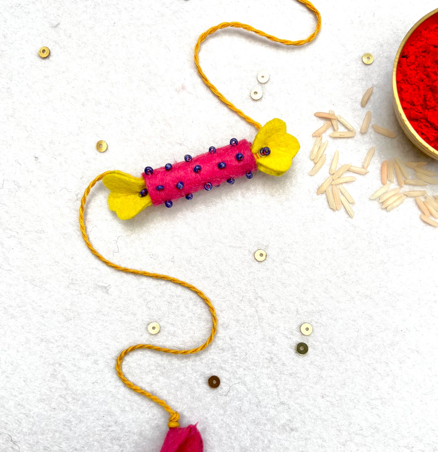 Hand embroidered Candy Rakhi-Pink