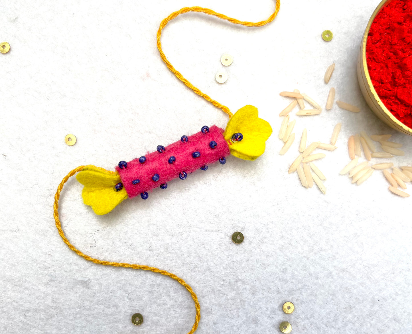 Hand embroidered Candy Rakhi-Pink