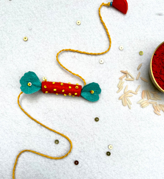 Hand embroidered Candy Rakhi-Orange
