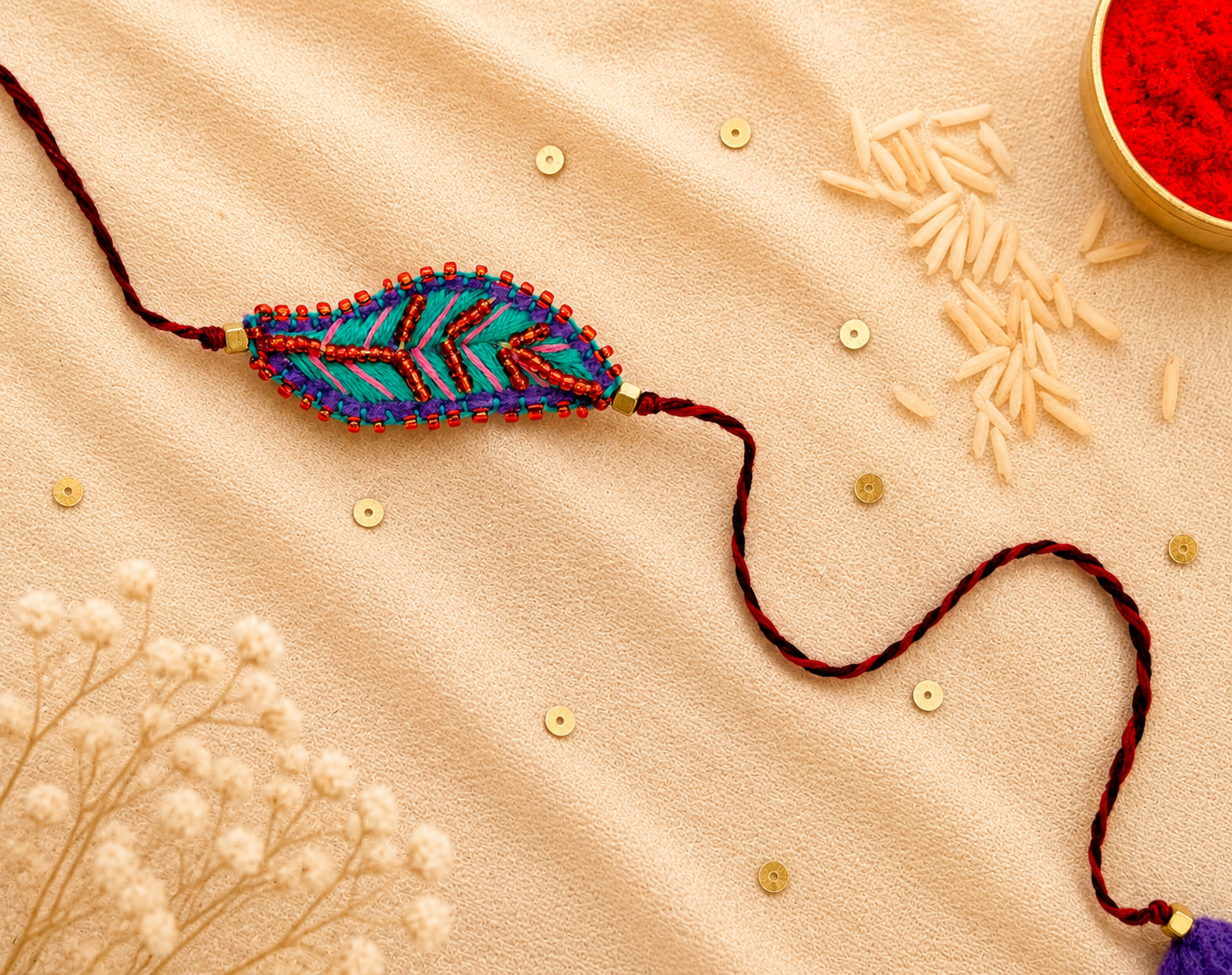 Hand embroidered Leaf Ornamental Rakhi (Sea Green-Pink)